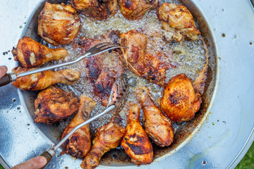 Neck chops and chicken legs frying in hot oil