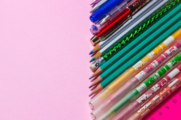 Fototapeta premium School supplies. Education concept. Stationery. There is a place for an inscription or logo. Photo on a pink background
