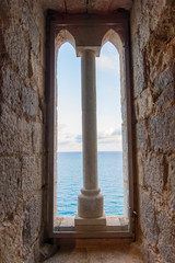 view of the sea from the window of the castle of Peñiscola, Spain