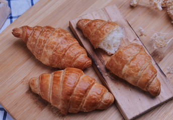 Croissants on the wooden board