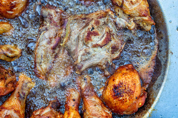 Obraz na płótnie Canvas Neck chops and chicken legs frying in hot boiling oil