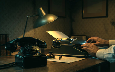 Film noir journalist working at office desk
