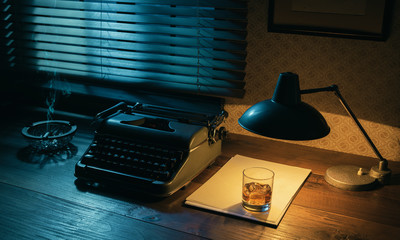 Vintage writer desktop with typewriter and a glass of whiskey - obrazy, fototapety, plakaty