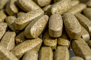 Dietary supplement pills. Herbal drug an alternative medicine. Macro close-up