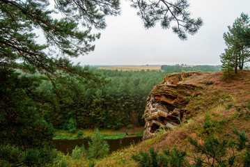 Beautiful river landscape with forest slopes of mountains. Limestone rocks in the Ural mountains....