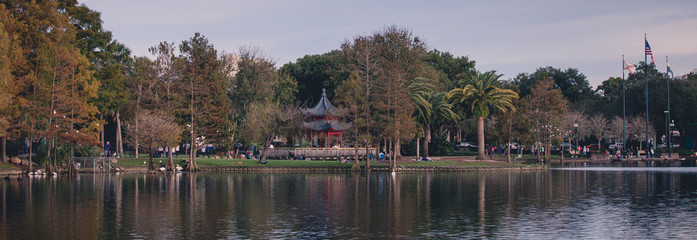 Chinese pavilion during a stroll through downtown Lake Eola on Orlando Florida on a fall winters afternoon on a weekend day. Lake Eola Park is located in the heart of Downtown Orlando, with a sidewalk © Tamara Sales 