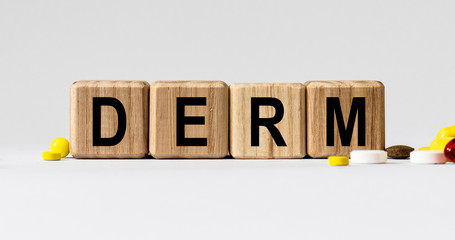 cubes with the word DERM on them. Care concept.