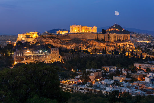 The Parthenon on Acropolis Hill in Athens Greece with full moon