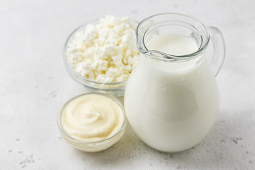 Milk in a jar and various dairy products. Copy space.