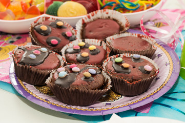 Muffin cup cakes on a plate.