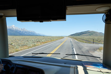 A view out an RV dashboard of Jackson Hole, Wyoming