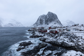Fototapeta na wymiar Beautiful traditional fishing red rorbuer huts in Hamnoy village during a storm. Lofoten Islands, Norway, Scandinavia.