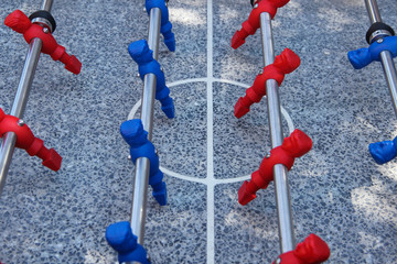 Table football game. Foosball table made of granite. Competitive spirit.