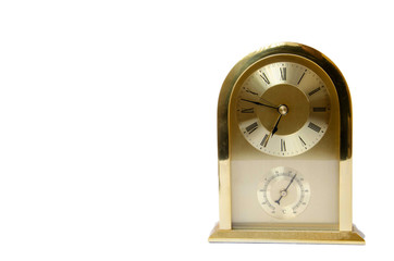 Alarm clock rectangular golden. Vintage home clock. Golden clock on a white background.
