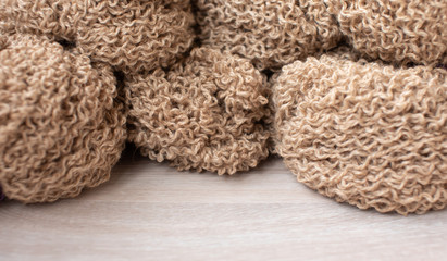 Woolen yarn for knitting. Wool thread for knitting. Own hand. Knitting and needlework. Yarn for a scarf, sweater and socks