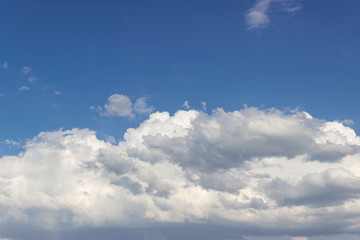 
Sky with white gray clouds lit by the sun