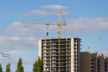 Construction crane and top of a building under construction