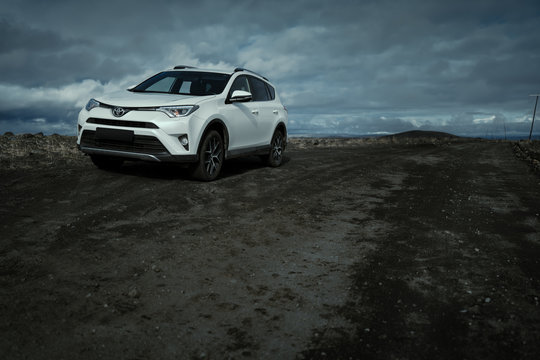 Southern Region, Iceland - September 9, 2019: White car Toyota RAV4 is parked at countryside off road in Southern Region, Iceland. Rental car