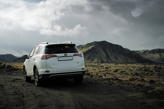 Southern Region, Iceland - September 9, 2019: White car Toyota RAV4 is parked at countryside off road in Southern Region, Iceland. Rental car