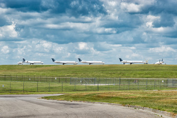 Fototapeta na wymiar Passenger Jet Aircraft Lined Up Waiting On Takeoff Permission