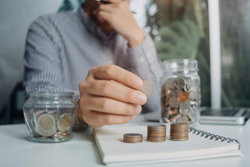 Business people use tablets and hold credit cards as an online shopping concept With a calculator and a book placed on the table