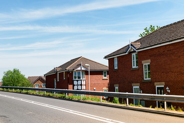 Red brick houses along the road.
