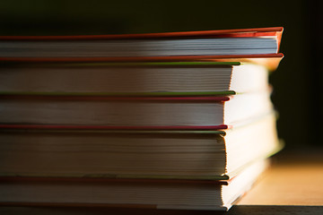 Close-up of a stack of books. The concept of home reading of paper books, school education and Institute, back to school. Space for text, background.