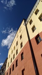 Fragment of brick wall against a blue sky