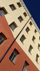 Fragment of brick wall against a blue sky