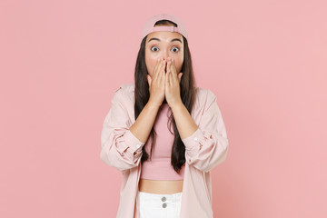 Shocked young asian woman girl in casual clothes cap posing isolated on pastel pink wall background studio portrait. People emotions lifestyle concept. Mock up copy space. Covering mouth with hands.