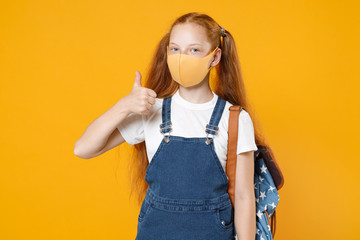 Young redhead school teen kid girl 12-13 years old in white tshirt face mask backpack isolated on yellow background children studio portrait Distance education at home quarantine covid-19 ncov concept