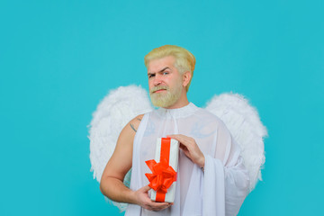 Bearded cupid with present. Valentines day cupid. Angel with present-box. Cupid in valentine day....