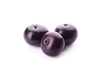 Fresh ripe acai berries isolated on white