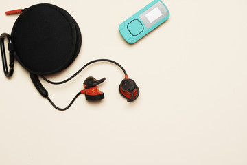 flat lay with mp3 and wireless headphones.