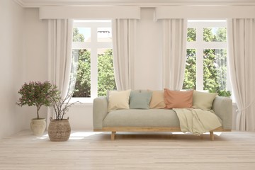 White living room with sofa and summer landscape in window. Scandinavian interior design. 3D illustration
