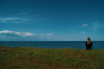 Girl in dress by the lake