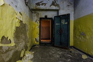 Opened heavy steel armored hermetic door in the Soviet bomb shelter