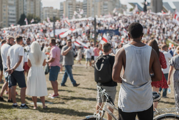 BELARUS, MINSK, 16 AUGUST 2020 a Black man watches a rally in Belarus,