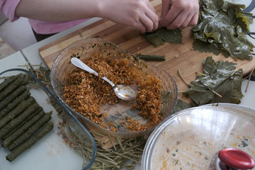 a housewife who prepared the stuffed grape leaves,homemade stuffed leaves, snack foods stuffed leaves,