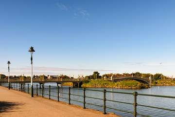 Depopulated promenade along the river.