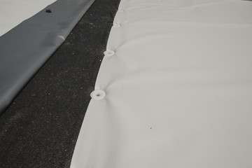 Pvc membrane fixed with dowels to be welded.