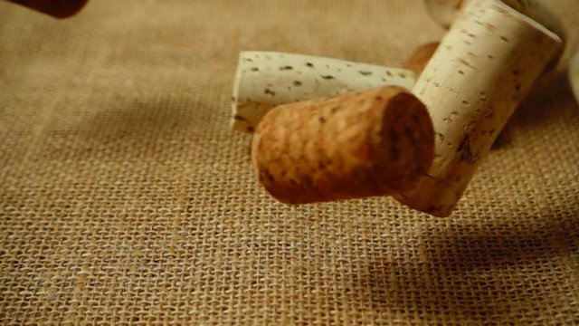 Falling wine corks from wine bottles on the bag. Slow motion.

