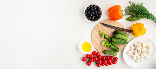Banner with ingredients for summer vegetable salad with feta cheese and mustard on light concrete background. 