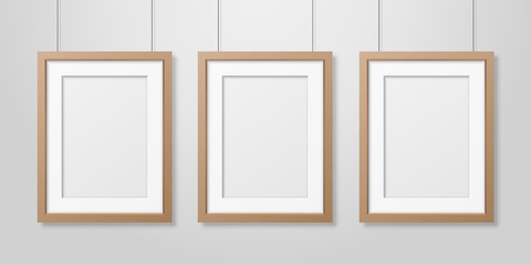 Vector 3d Realistic Three A4 Brown Wooden Simple Modern Frame on a White Wall Background. It can be used for presentations. Design Template for Mockup, Front View