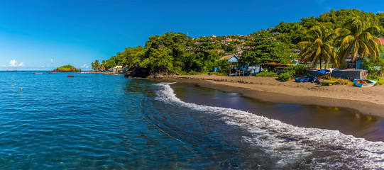 A view of surf breaking on the shoreline at Barrouallie, Saint Vincent
