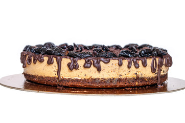 Homemade cake with chocolate cream and prunes.