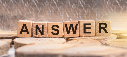 Wooden blocks with the word Answer. Business and finance concept.