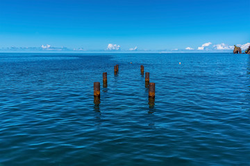A view out to sea across jetty foundations at Wallilabou Anchorage, Saint Vincent