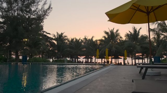 empty swimming pool of luxury hotel after sunset