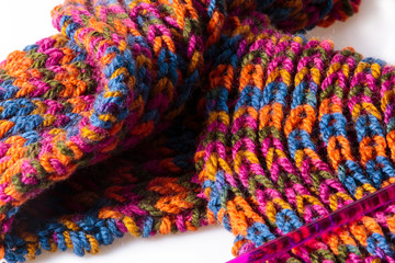 Soft warm handmade woolen scarf and a knitting needle